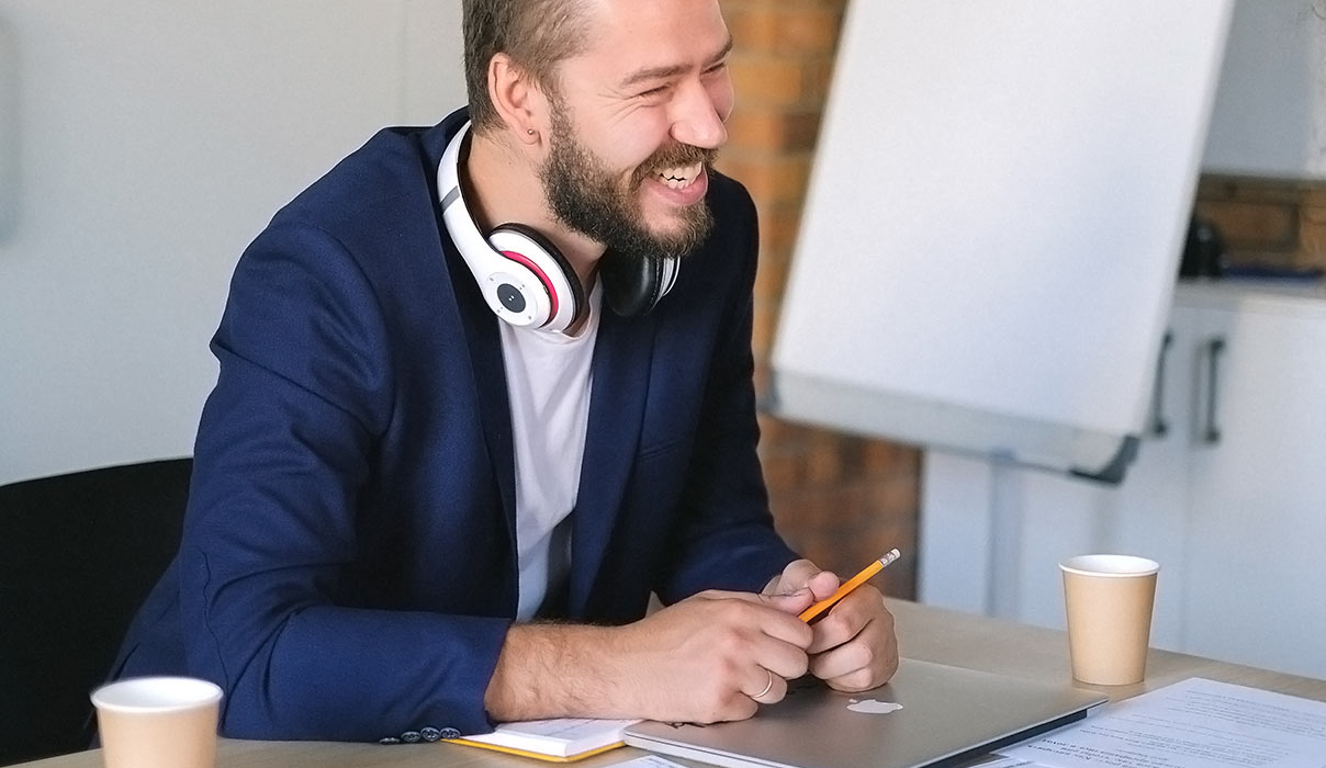 Man with Headphones Laughing